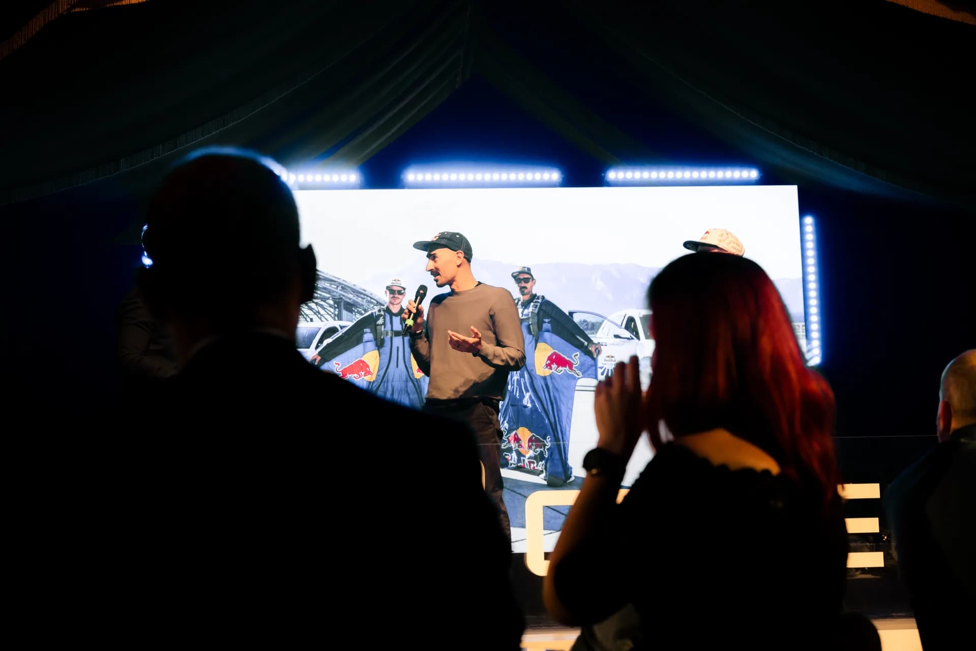 Skydiver Marco Waltenspiel speaking on stage at the Geely Brand Launch Night at the MIRAGE